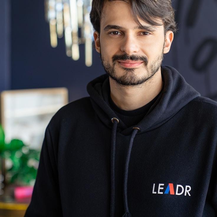 Anaya Sharma, Lead Design Curator at SoftMatrixStudio, reviewing corporate floral arrangements